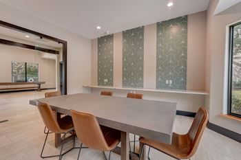 a conference room with a large table and chairs